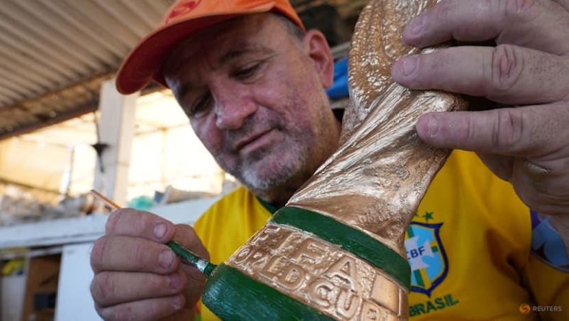 In Rio, artisan crafts World Cup trophies while hoping Brazil gets a real one