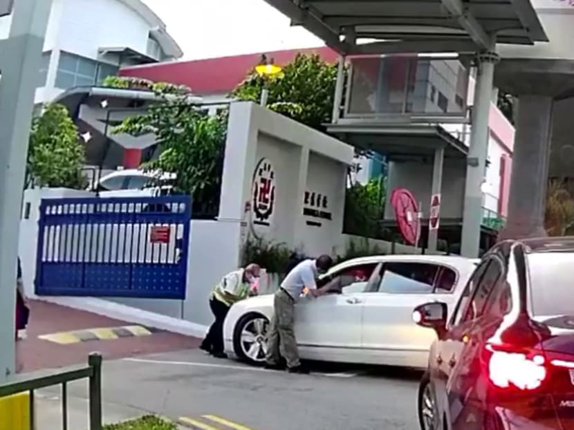 MOE looking into case of driver seen pushing back security officer with his car at Red Swastika School