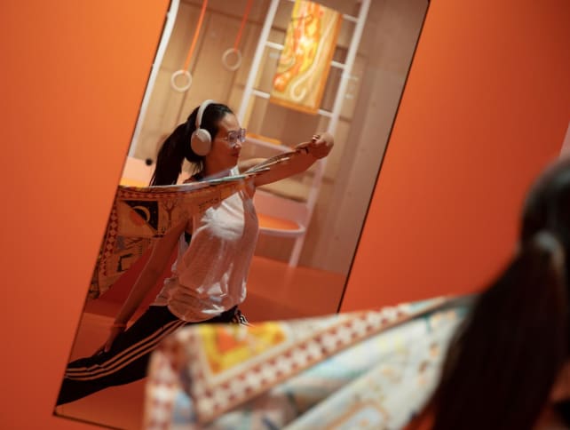 TODAY intern journalist Wong J-min doing the Carre yoga at the HermesFit pop-up gym located at 16 Orchard Road on April 17, 2023. 