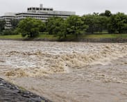 Four injured, flights cancelled in Japan as twin storms approach