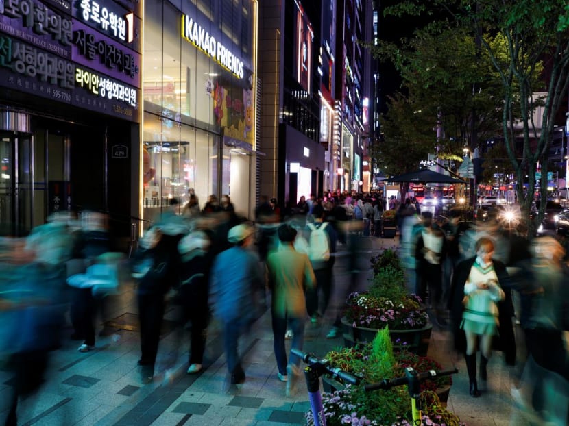 People walk through a Gangnam district in Seoul, South Korea on Oct 20, 2023. 