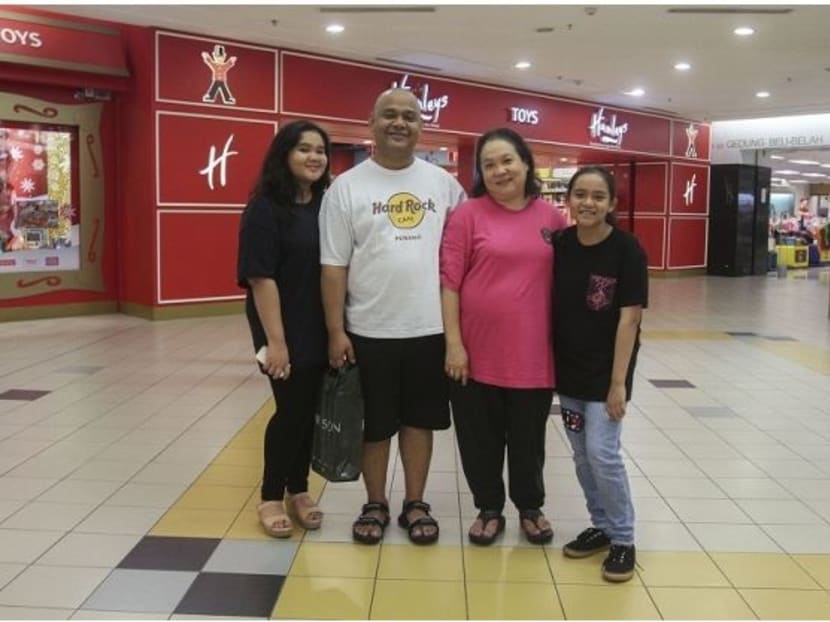 Mr Annuar Rizwan poses with his family at a supermarket in Kuala Lumpur. Photo: Malay Mail Online