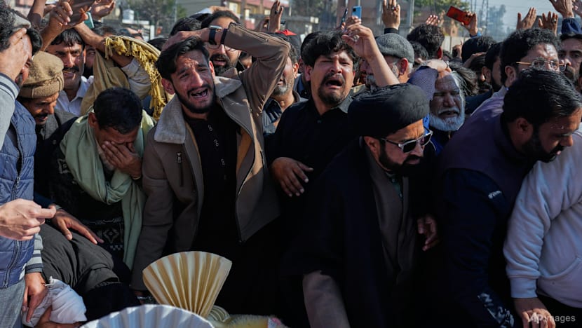 Thousands mourn victims of suicide bombing in Islamabad, as four arrests made
