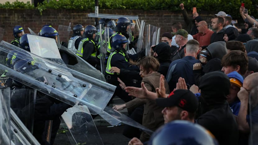 UK interior minister condemns violent reaction to handcuffed student's murder