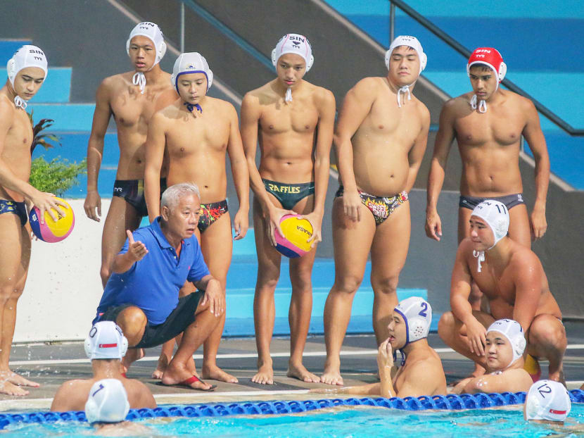 A pep talk for Singapore’s Under-23 water polo team during their friendly match against Slovakian club side Kupele Piestany. Photo: Shawn Lim, Voxsports