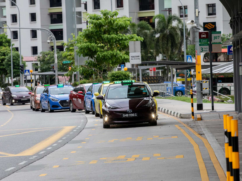 Taxis waiting at Clementi MRT station stand on May 17, 2021.