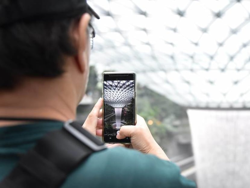 Commentary: Why Jewel Changi Airport should be enjoyed in person – not through a smartphone Commentary: Why Jewel Changi Airport should be enjoyed in person – not through a smartphone