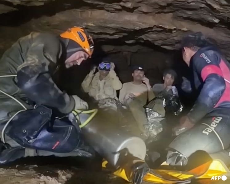 Rescuers free four more men trapped in semi-submerged Laos cave