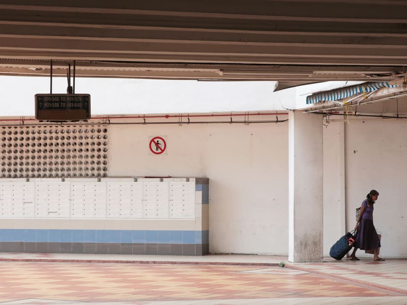 Long-time resident Mdm Tay, 70, leaving with her belongings after handing over the keys of her four-room flat at Rochor Centre yesterday. Photo: Jason Quah