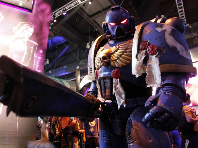 A character from the video game Warhammer 40,000: Space Marine published by THQ poses at Electronic Entertainment Expo (E3) 2011. Photo REUTERS