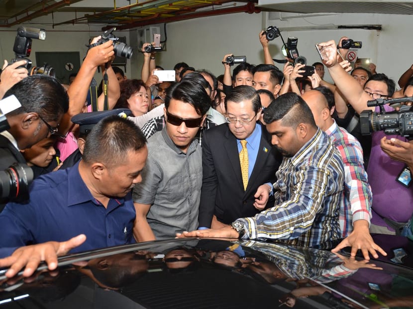 Penang Chief Minister Lim Guan Eng (in suit and yellow tie) has been arrested for corruption. Photo: Lim Guan Eng's Facebook page