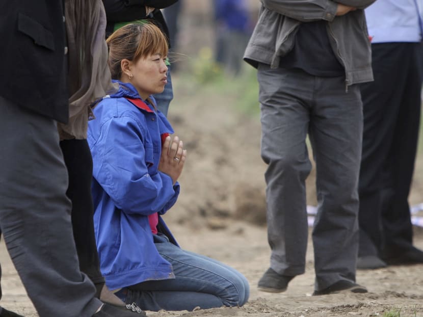 Gallery: China farm fire: Relatives scuffle with police, demand answers