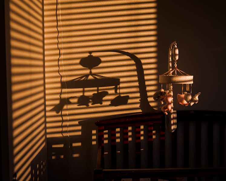 Woman charged with dropping 2-month-old baby into cot, fracturing her skull