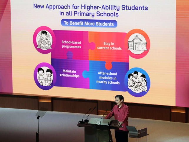 Prime Minister Lawrence Wong announcing a change to an education policy at the National Day Rally on Aug 18, 2024.