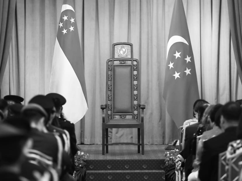 The Presidential Chair flanked by the State Flag and the Presidential Flag seen at an appointment ceremony at the Istana on May 13, 2015. Photo: Wee Teck Hian