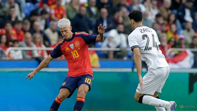 Second-string Spain held by Iraq in low-key World Cup send-off