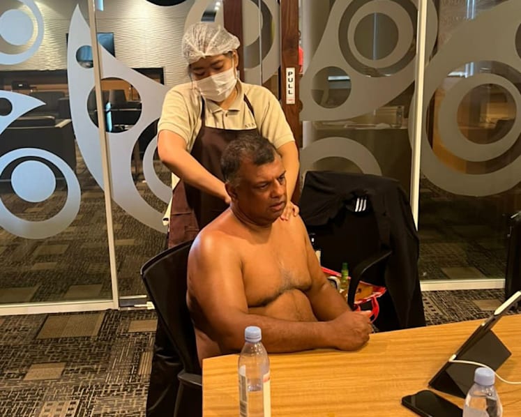 AirAsia boss Tony Fernandes draws flak for shirtless massage during work call