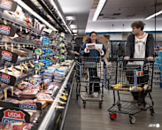 US revises first quarter growth down while inflation climbs