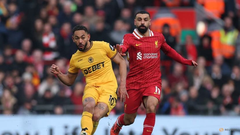 Liverpool edge past Wolves to go seven points clear at top