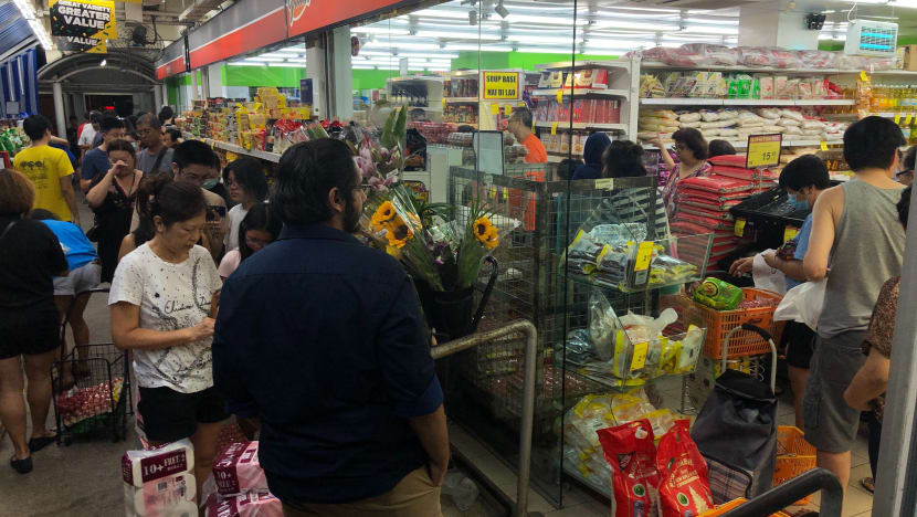 Singaporeans rush to supermarkets after Malaysia announces lockdown, but no widespread excessive buying