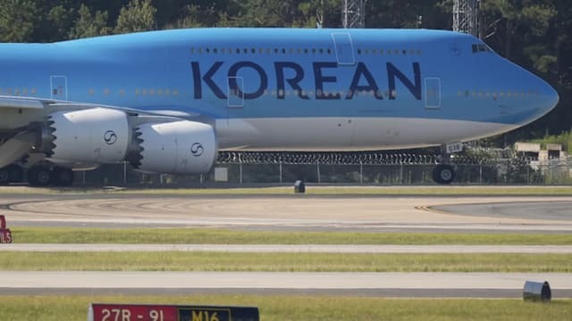 飞美国接被扣押公民 韩国包机今天返航