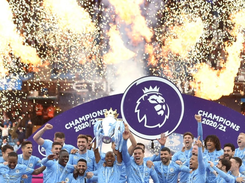 Manchester City's Brazilian midfielder Fernandinho lifts the Premier League trophy during the award ceremony after the English Premier League football match between Manchester City and Everton at the Etihad Stadium in Manchester, north west England, on May 23, 2021. Manchester City's Brazilian midfielder Fernandinho lifts the Premier League trophy during the award ceremony after the English Premier League football match between Manchester City and Everton at the Etihad Stadium in Manchester, north west England, on May 23, 2021.