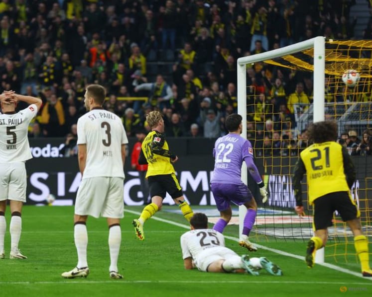 Dortmund waste two-goal lead but score stoppage-time win over St Pauli