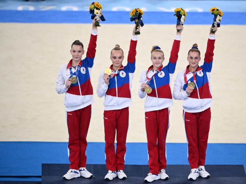 Gold medalists Russia's Liliia Akhaimova, Russia's Angelina Melnikova Russia's Viktoriia Listunova and Russia's Vladislava Urazova celebrate on the podium after winning the artistic gymnastics women's team final during the Tokyo 2020 Olympic Games at the Ariake Gymnastics Centre in Tokyo on July 27, 2021.