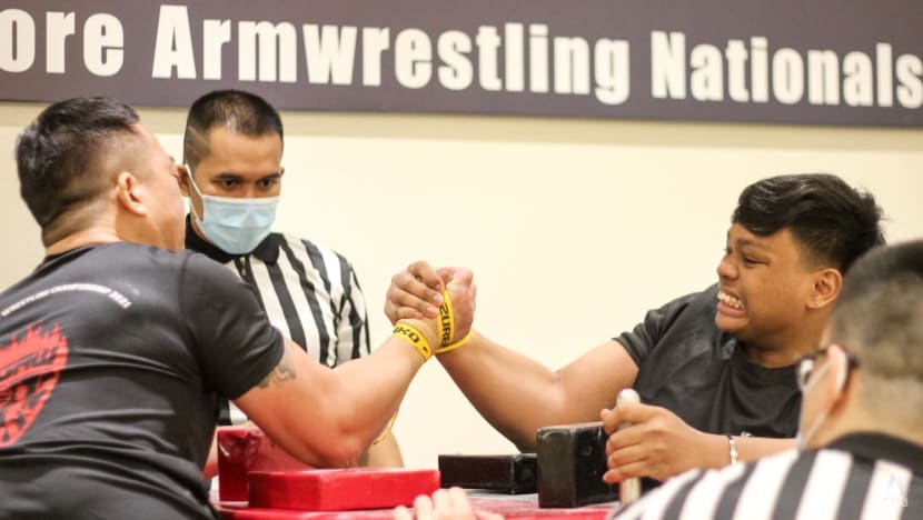 Flexing muscles to grow the sport: Singapore’s arm wrestlers face off at first national championships