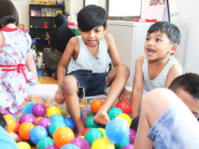 Two of the children, 6-year-old Quazza Ilhandyl (right), and his 4-year-old brother, Qashan Lqzrafil (left), playing with toys provided at the launch of the North East Community Library on June 19, 2016. Photo: Damien Teo/TODAY Two of the children, 6-year-old Quazza Ilhandyl (right), and his 4-year-old brother, Qashan Lqzrafil (left), playing with toys provided at the launch of the North East Community Library on June 19, 2016. Photo: Damien Teo/TODAY