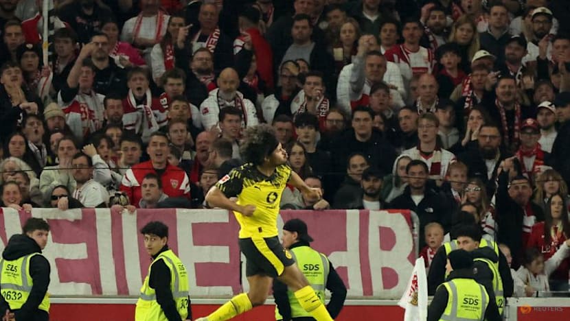 Dortmund score twice in stoppage time to beat Stuttgart 2-0