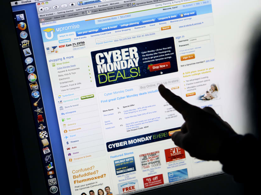 A consumer looks at Cyber Monday sales on her computer at her home in Palo Alto, California. Photo: AP