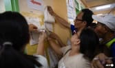 Philippines votes in high-stakes midterms amid Marcos-Duterte showdown