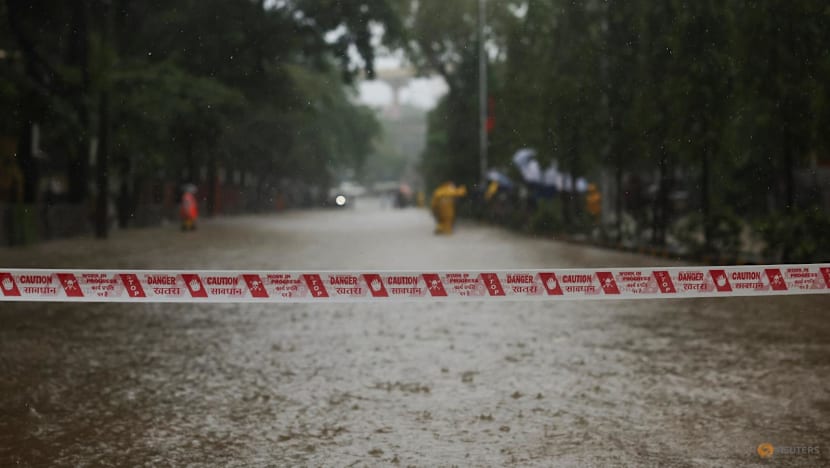 Building collapse kills six in Mumbai as torrential rain batters city