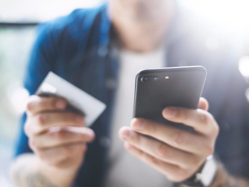 Muhammad Ilyas Mohamed Noor, 23, used more than S$11,000 from his patients' cards and attempted to obtain another S$32,000 worth of goods and services.