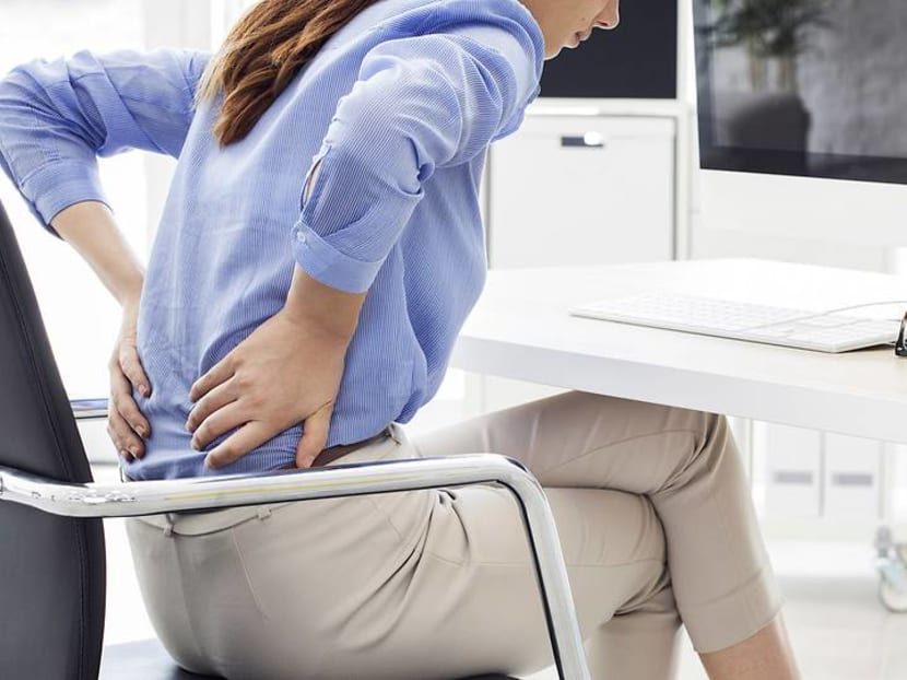 Commentary: More people are in pain – from sitting at their desks all day Commentary: More people are in pain – from sitting at their desks all day