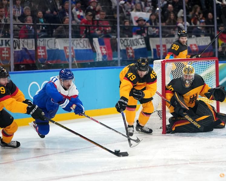 Ice hockey-Slovakia muscle past Germany into semi-finals