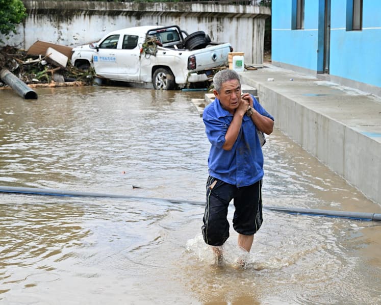 Beijing evacuates residents, expands storm alert as deadly floods keep city on edge  