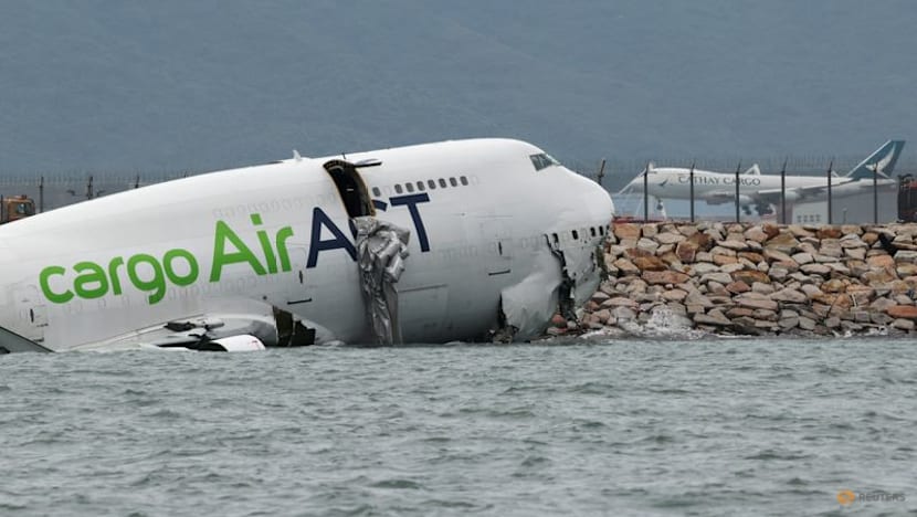 Cargo plane slides off runway in Hong Kong, killing two airport staff