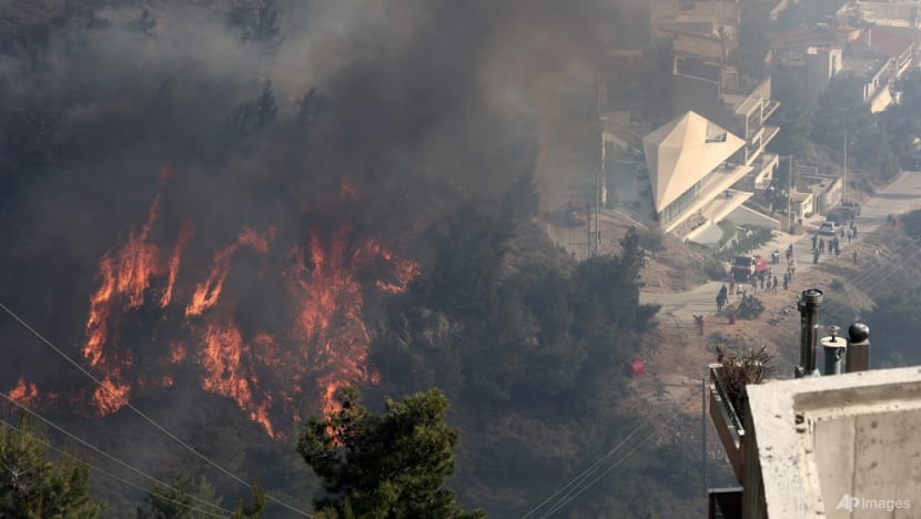 Greek firefighters battle blaze near Athens for second day