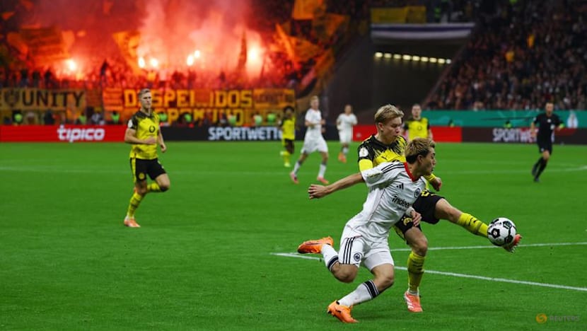 Dortmund advance in German Cup after shootout win at Frankfurt