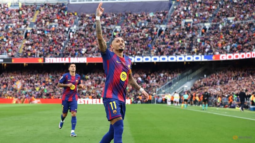 Raphinha hat-trick fires Barcelona past Sevilla to stay top