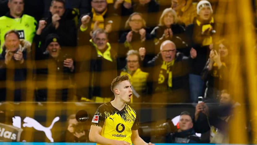 Dortmund confirmed Bundesliga runners-up 3-2 with win over Frankfurt