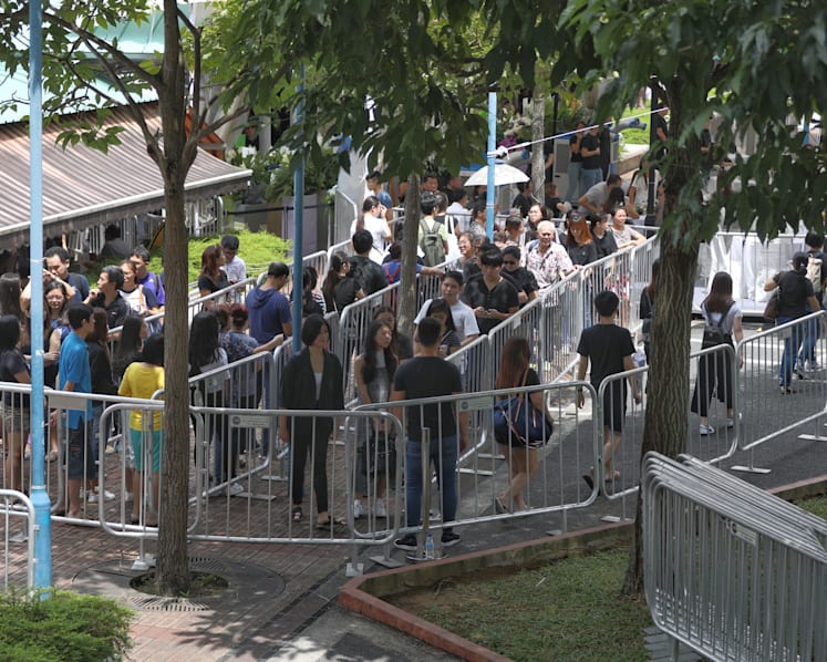 Crowd grows as Aloysius Pang's wake opens to fans and members of the public