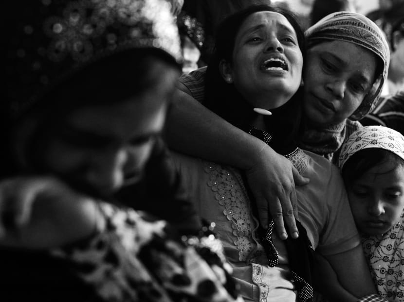 A woman crying near the body of her husband Soe Min, one of two men killed in a recent riot at a mosque in Mandalay this month. The US extended sanctions due to wider concerns about conflict triggered by religious clashes, but other countries may have less compunction. Photo: Reuters