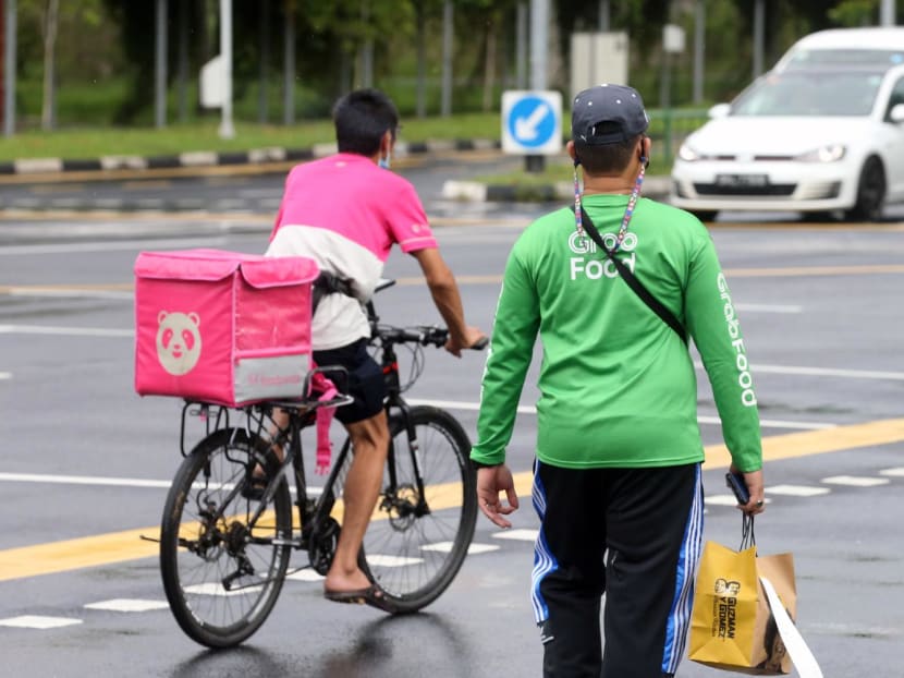 Food delivery riders at a junction between Yishun Central and Yishun Avenue 2 on May 8, 2022. Food delivery riders at a junction between Yishun Central and Yishun Avenue 2 on May 8, 2022.