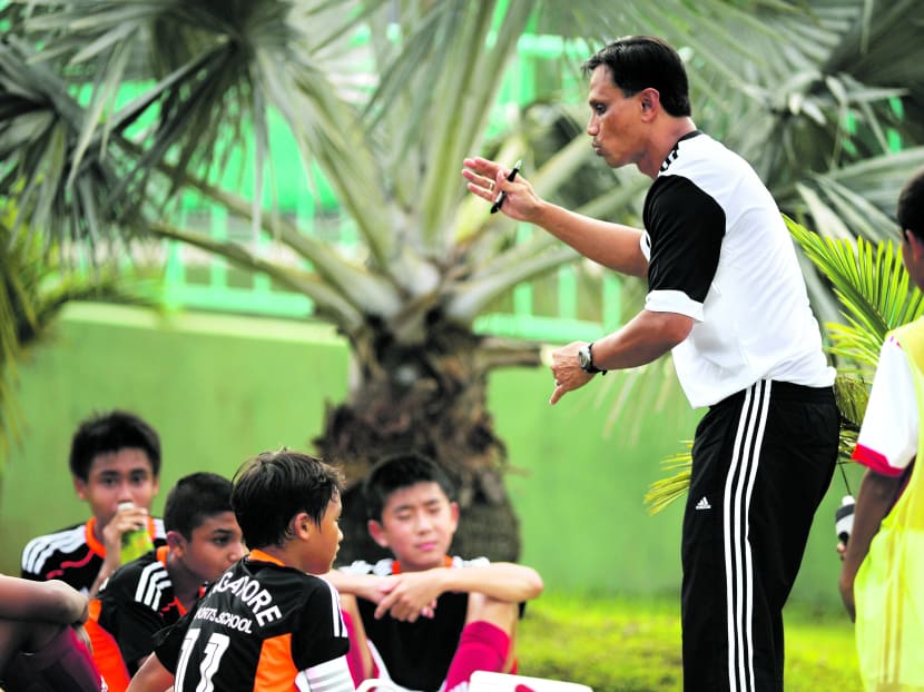 Former Singapore international Abdullah Noor (right, in white) is leaving his role as head coach of the Singapore Sports School’s U-14 football team, possibly for a coaching role in Australia. Photo: Singapore Sports School
