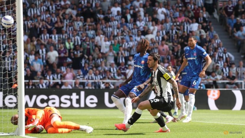 Newcastle go third with 2-0 win over 10-man Chelsea