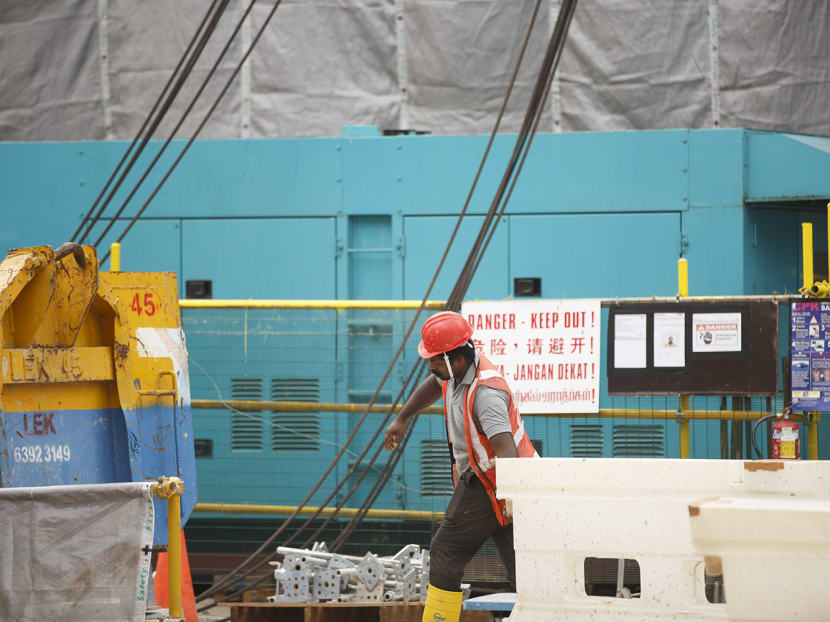 A worker at a construction site along North Bridge Road on May 13, 2022.