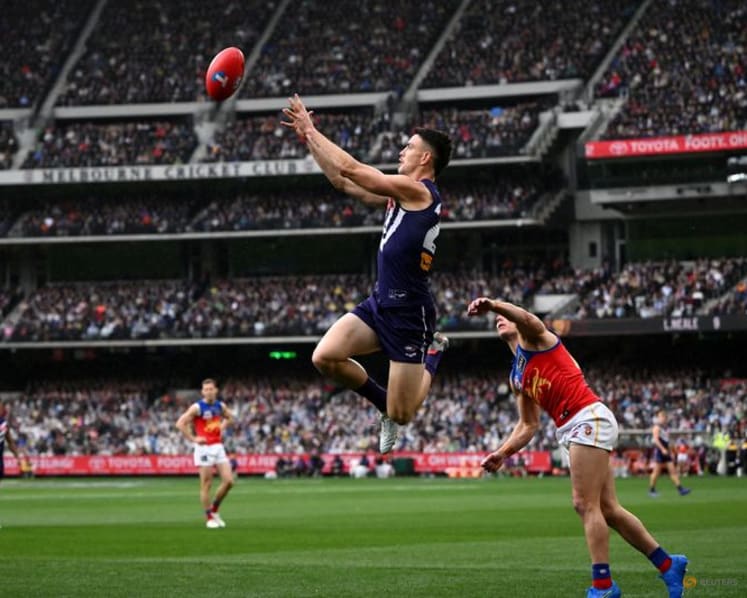 Australian Rules-Brisbane hold off Fremantle in thriller to win third straight AFL Grand Final